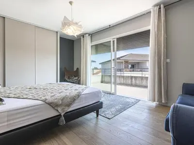 a bedroom with a bed and a large window at Apartment La vallée by Interhome in Aléria
