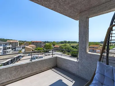 a room with a balcony with a view at Apartment La vallée by Interhome in Aléria