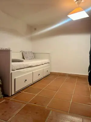 a bedroom with a bed and a light on the ceiling at Porticcio, Villa Terra di Sole in Grosseto-Prugna