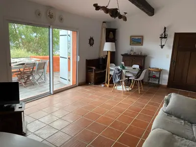 a living room with a couch and a table at Porticcio, Villa Terra di Sole in Grosseto-Prugna