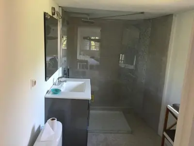 a bathroom with a sink and a shower at Porticcio, Villa Terra di Sole in Grosseto-Prugna