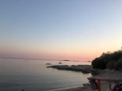 a view of the ocean at sunset at Cocon chaleureux bord de plage vue sanguinaire in Ajaccio