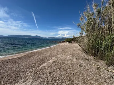 a beach with a rocky shore and the ocean at La bella Vista di Civita de Pietrosella in Pietrosella