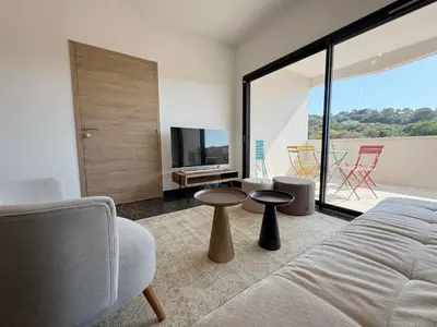 a living room with a couch and a tv at La bella Vista di Civita de Pietrosella in Pietrosella