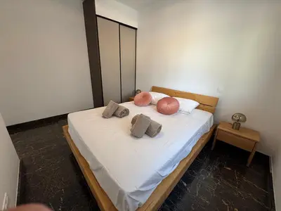 a bedroom with a bed with two pillows on it at La bella Vista di Civita de Pietrosella in Pietrosella