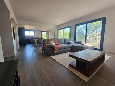 a living room with a couch and a coffee table at U Mandriolu in Prunelli-di-Fiumorbo