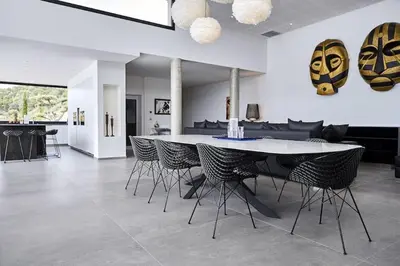 a dining room with a table and chairs at Villa Bianca in Zonza