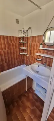 a bathroom with a tub and a sink at Maison porticcio vue mer chez Olivier in Grosseto-Prugna