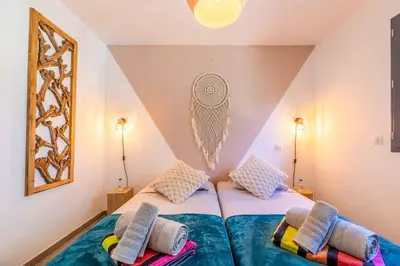 a bedroom with two beds with pillows on them at Villa Casa Pietranera in Porto-Vecchio