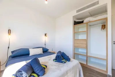 a bedroom with a bed and a bunk bed at Villa Casa Pietranera in Porto-Vecchio