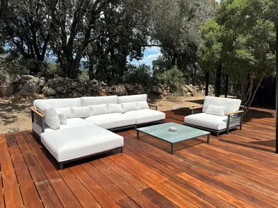 two white couches and a table on a wooden deck at Villa Casa Pietranera in Porto-Vecchio