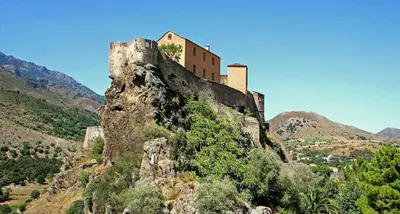 a castle on the top of a mountain at Corsica sea mountain and pool in Santa-Maria-Poggio
