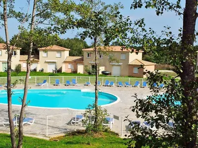a swimming pool in a resort with chairs and trees at Corsica sea mountain and pool in Santa-Maria-Poggio