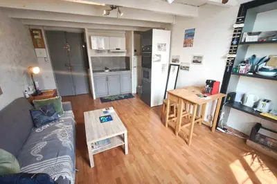a living room with a couch and a table at Central studio in Ajaccio quiet and convenient in Ajaccio