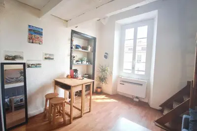 a small room with a table and two stools at Central studio in Ajaccio quiet and convenient in Ajaccio