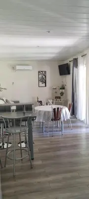 a dining room with a table and chairs at Maison de vacances en Corse in Prunelli-di-Fiumorbo