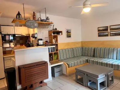 a living room with a couch and a table at ST CYPRIEN A6 5 pers à 250m de la plage de sable Saint Cyprien in Lecci
