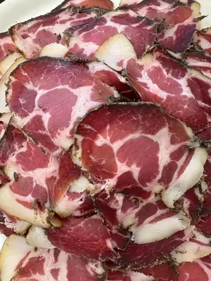 a close up of a piece of meat on a plate at Ferme auberge U sapè fà in Saliceto