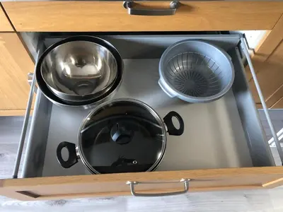 a stove with three pots and pans on it at T3 en duplex au cœur de Piana in Piana