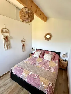 a bedroom with a bed in a room at Appartement avec terrasse privée et piscine in Sarrola-Carcopino