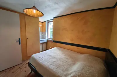 a bunk bed in a room with a table at Spacious villa with pool and sea views in Villanova