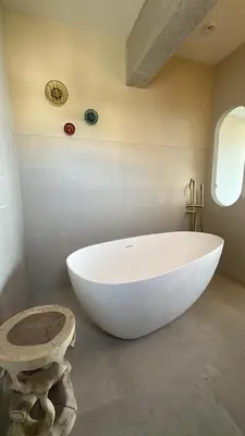 a large white bath tub in a bathroom at Appartement exceptionnel vue mer in Ajaccio
