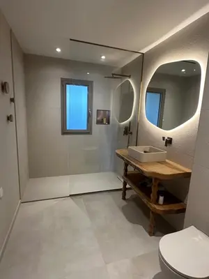 a bathroom with a toilet and a sink and a mirror at Appartement exceptionnel vue mer in Ajaccio