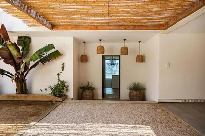 an open entry way with a wooden ceiling at Villa Lalie in Olmeto