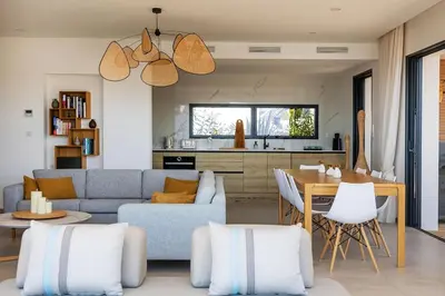 a living room with a couch and a table at Villa Lalie in Olmeto