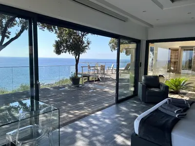 a living room with a view of the ocean at La Colline by Pinarello Villa Services in Fautea