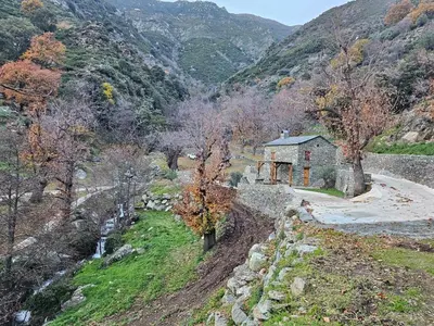 a house in the middle of a mountain at Bergerie in Volpajola