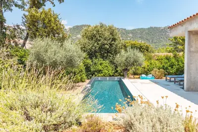 a pool in the garden of a villa at Villa Cupulatta Di Santa Lucia in Sainte-Lucie de Porto-Vecchio