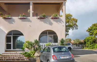 a car parked in front of a house at 2 Bedroom Cozy Apartment In Prunete in Prunete