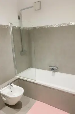 a bathroom with a sink and a shower and a toilet at Evasion Méditerranée - Vue Mer in Ajaccio