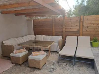 a wooden table with two bowls on top of it at villa louise in Calenzana