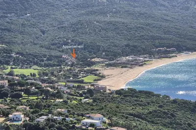an aerial view of a beach and the ocean at Studio with sea view in Calcatoggio