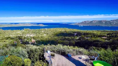 an aerial view of a house with a view of the ocean at Villa Panorama Porto-Vecchio in Porto-Vecchio