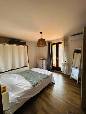 a small bedroom with a bed and a window at Corse VallisPoenina 2B in Poggio-Mezzana