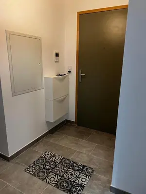 a room with a door and a rug on the floor at Appartement T2 neuf résidence U Scalu in Santa-Lucia-di-Moriani