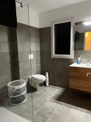a bathroom with a toilet and a sink at Appartement T2 neuf résidence U Scalu in Santa-Lucia-di-Moriani