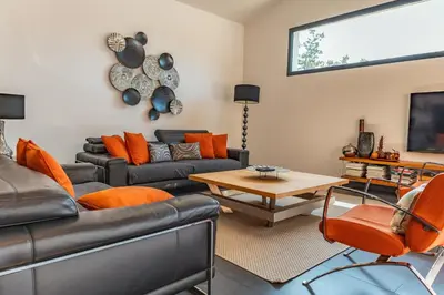 a living room with couches and a table at Casa Carolina Di Palombaggia in Porto-Vecchio
