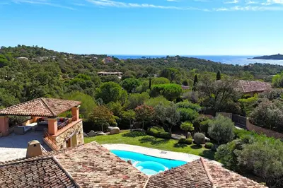 an aerial view of a house with a swimming pool at Villa Domaine de Pinarello in Pinarellu