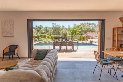 a living room with a couch and a patio at Villa Felicita di Lecci in Lecci