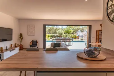 a living room with a view of a pool at Villa Felicita di Lecci in Lecci