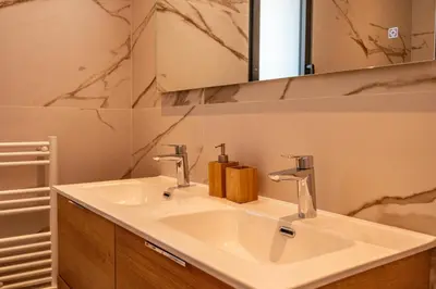 a bathroom with a white sink and a mirror at Villa Felicita di Lecci in Lecci
