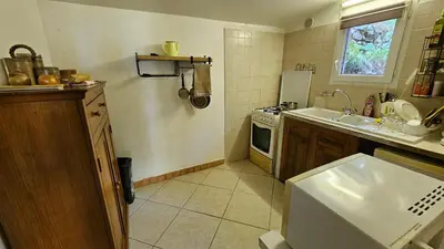 a kitchen with a sink and a stove at CHALET BAVEDDA- Accès chemins de randonnée- Calme - Montagne in Quenza