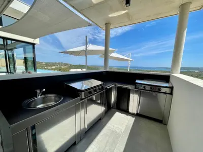 a kitchen with a sink and a counter top at Villa contemporaine ORIZONTE - 15 pers - 400m2 vue mer in Zonza
