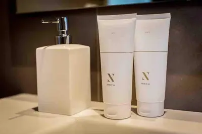 a couple of bottles ofodorizers sitting on a counter at La Prairie in Porto-Vecchio