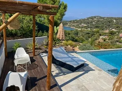 a large window with a large view of the ocean at Villa With Views Over Gulf Of Ajaccio in Coti-Chiavari