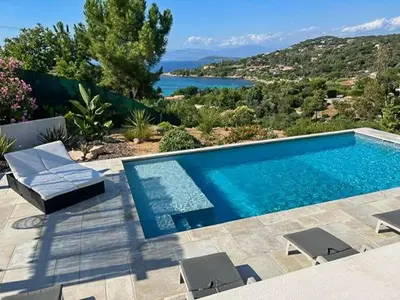 a swimming pool with a view of the water at Villa With Views Over Gulf Of Ajaccio in Coti-Chiavari